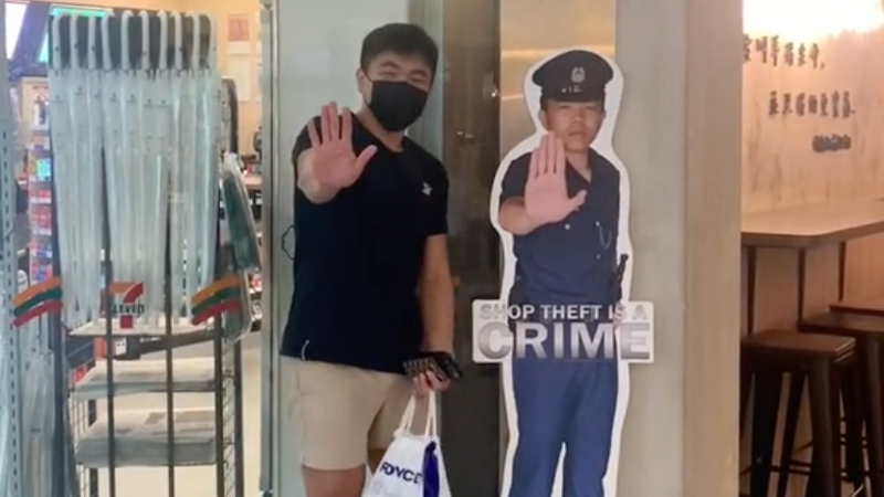 The birthday boy stands next to his police standee. Photo: T1ew_/TikTok
