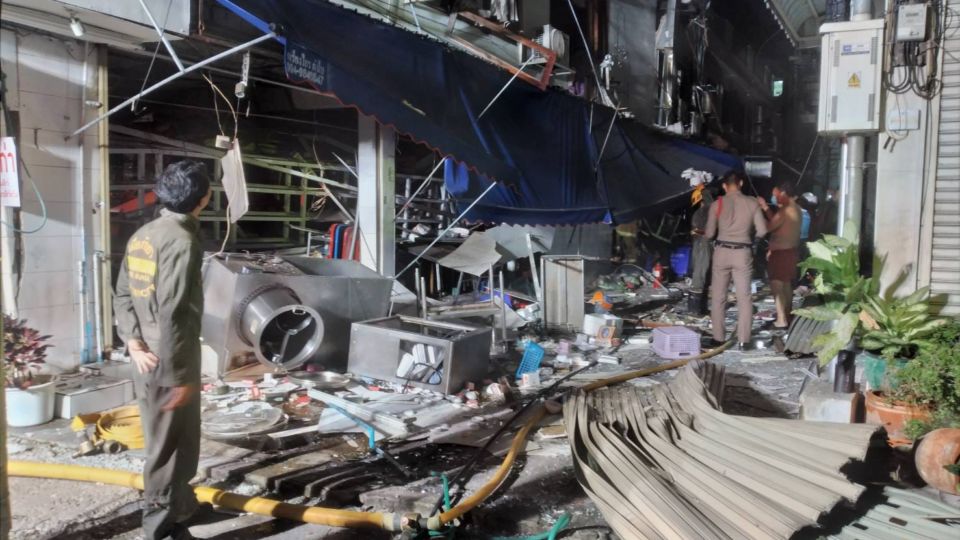 Kitchen equipment was blasted into the street, and no chicken rice would await customers today after a large explosion damaged a small restaurant in Pattaya early Tuesday morning. Photo: Chonburi Provincial Police