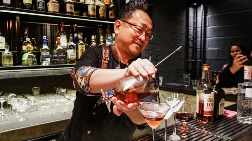 A 2019 file photo of Hidetsugo Ueno, co-founder of Find the Locker Room, pours his signature drink. Photo: Chayanit Itthipongmaetee / Coconuts Bangkok
