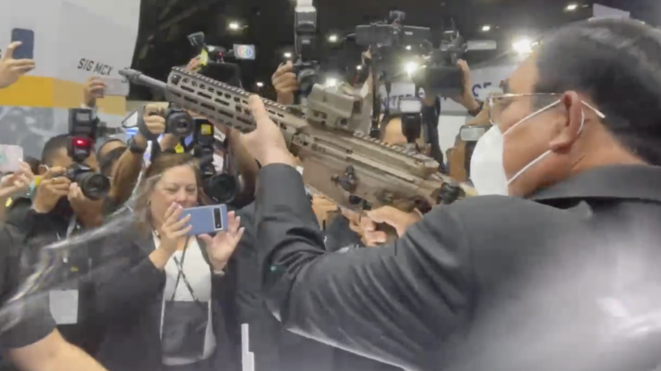 Suspended Prime Minister Prayuth Chan-ocha aims a rifle at a weapons exhibition in northern metro Bangkok. Image: Wassana Nanuam/Twitter