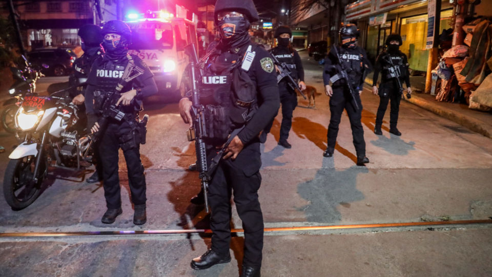 Policemen prepare for a  total lockdown in Sampaloc district in Manila, Philippines April 23, 2020. Credit: Basilio Sepe/BenarNews