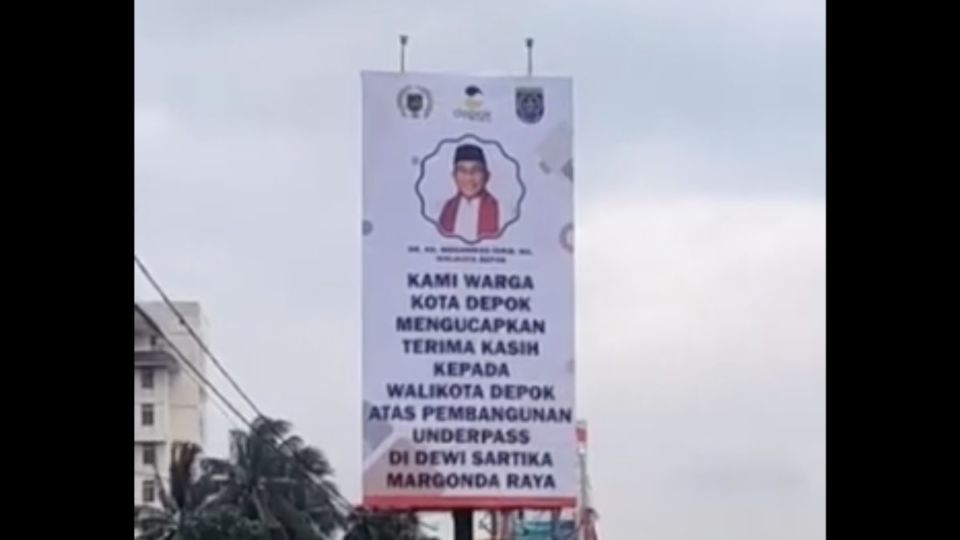 A billboard thanking Depok Mayor Mohammad Idris for the construction of an underpass. Photo: Video screengrab