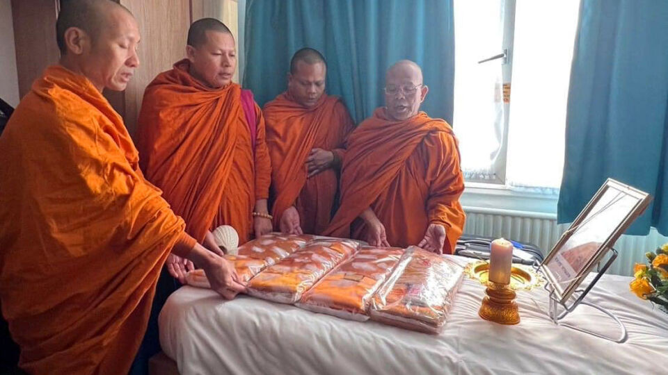 Monks pray in the room where 17-year-old Duangphet “Dom” Phromthep was found unresponsive earlier this month. The boy died on Feb. 14 at a hospital in Leicester, England, where he had gone to study four years after he was rescued from a cave in northern Thailand. Photo: Zico Foundation