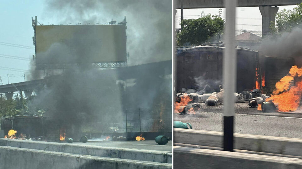 An LPG tanker burns Tuesday morning on Route 7 in greater metro Bangkok.