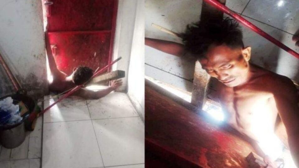 An Indonesian house thief stuck in a steel door as he tried to make his getaway. Photo: Handout