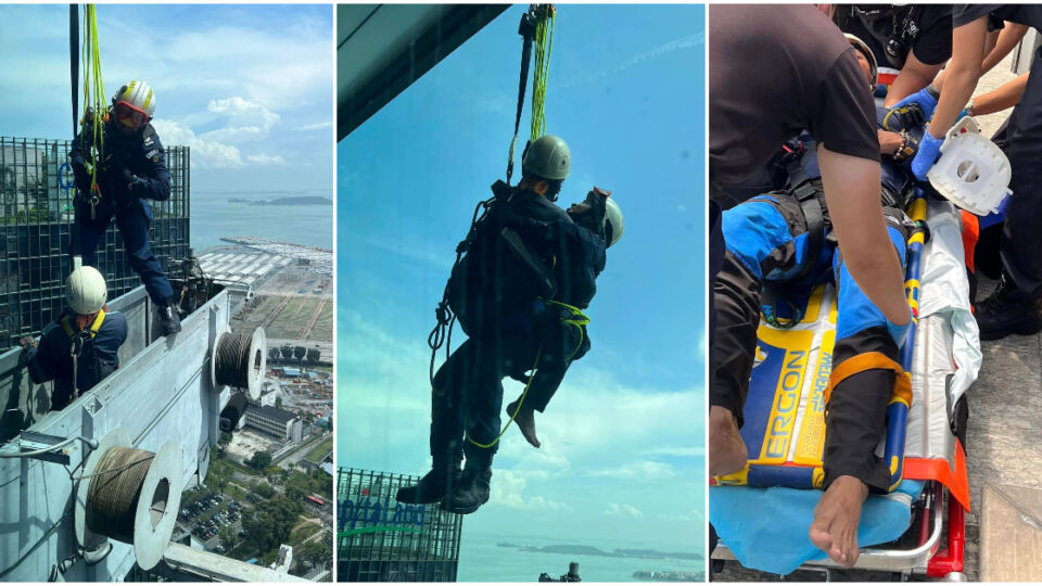 SCDF officers rescuing two workers stuck on the 40th floor of Capital Tower yesterday. Photos: SCDF/Facebook
