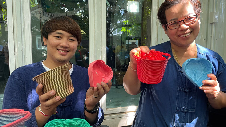 Joy of Bangkok’s Koh Klang, at right, shows off products made from plastic collected by her canal island community. Photo: Ewen Mcleish