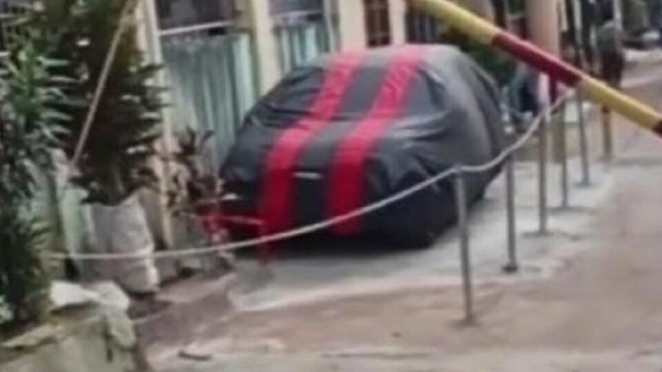 A family in Bekasi, West Java sectioning off a chunk of a public road to park their car, as their house lacks a garage. Photo: Video screengrab from TikTok.