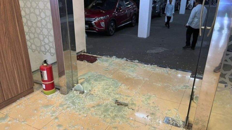 Shattered glass at the Indonesian Ulema Council (MUI) HQ in Jakarta from a shooting in the morning of May 2, 2023. Photo: Handout