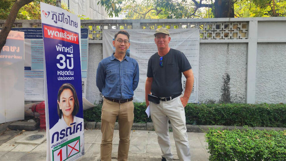 Soi Sukhumvit 53 residents Bhuvanant Bhuvanattrai, at left, and Robert Horn, stand in front of the project site for a hotel and residential spire called Upper Suites 53. They and other neighbors are opposed to its construction. Photo: Coconuts