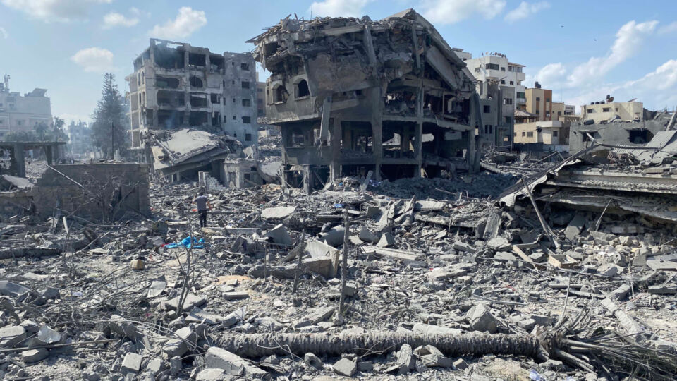 Palestinians inspect the damage following an Israeli airstrike on the El-Remal area in Gaza City on October 9, 2023. Israel continued to battle Hamas fighters on October 10 and massed tens of thousands of troops and heavy armour around the Gaza Strip after vowing a massive blow over the Palestinian militants’ surprise attack. Photo by Naaman Omar apaimages