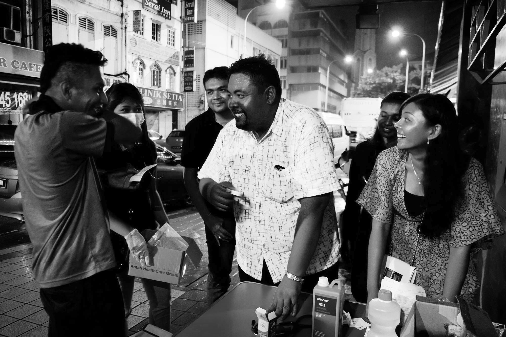 Dr Madhu Sudhan at the free clinic along with his 29-year-old sister, pharmacist Sudeshna. His brother Dr Krishna also volunteered ((Photo by Kamal Sellehuddin/Coconuts KL)