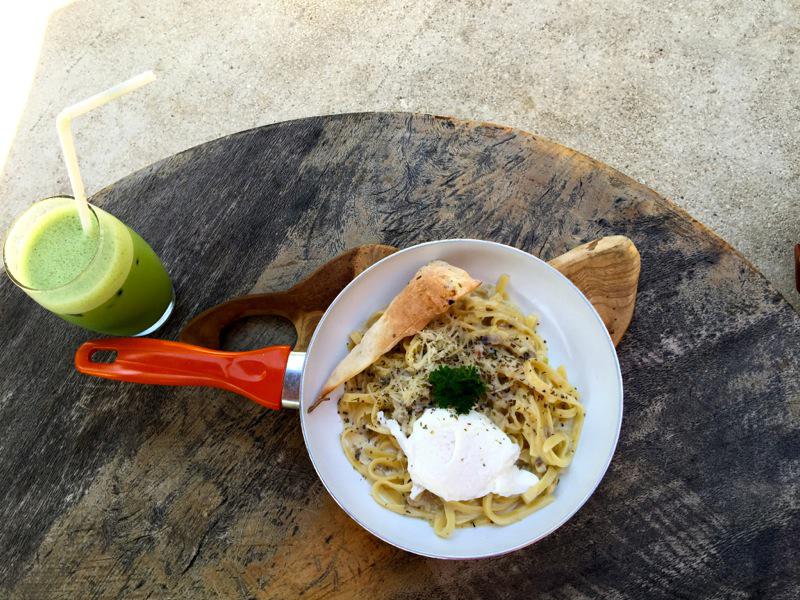 iced green tea latte and poached egg with fettuccine alfredo