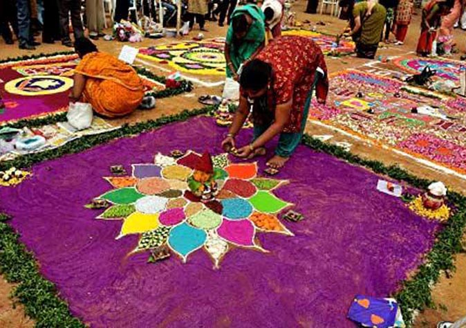 A woman in process of creating Rangoli. Photo: Indian Social Club