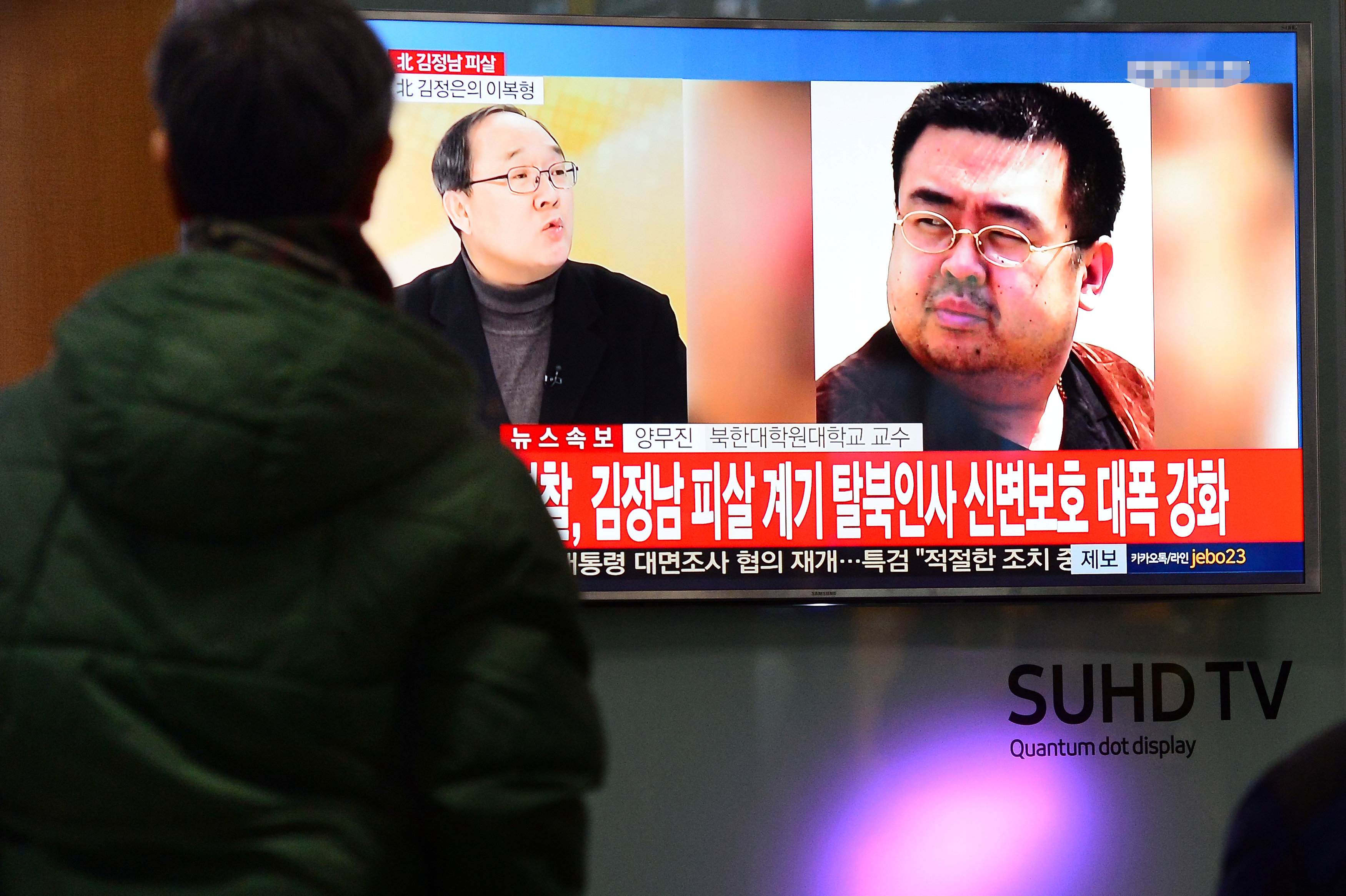 People watch a TV screen broadcasting a news report on the assassination of Kim Jong Nam. Photo: Reuters