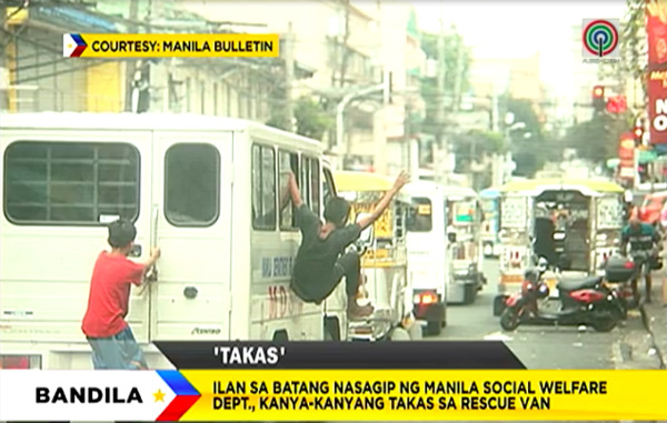 The kids jumped out of the van as they tried to escape the rescue van. PHOTO: Screen grab from ABS-CBN News