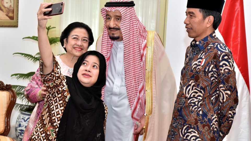 Indonesian President Joko Widodo (R) watches as former president Megawati Sukarnoputri and her daughter Puan Maharani, a minister in his cabinet, take a selfie with Saudi Arabia’s King Salman (C) at the presidential palace in Jakarta, Indonesia March 2, 2017 in this photo taken by Presidential Palace Photographer. Presidential Palace Photographer/Agus Suparto/Handout via REUTERS