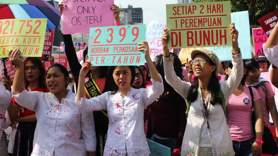 Activists holding up signs during Jakarta Women’s March on March 4, 2017.  Many of the same people behind the Jakarta Women’s March have organized this weekend’s Feminist Fest. Photo: Coconuts Media / Andra Nasrie