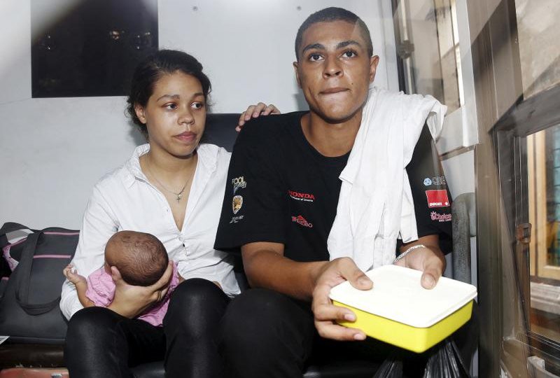 Americans Heather Mack and Tommy Schaefer sit with their baby, Stella on April 21, 2015. Photo: Darren Whiteside/Reuters