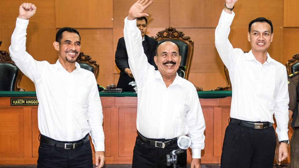 The leaders of Gafatar group (L-R) Mahful Muis Tumanurung, Ahmad Musadeq and Andry Cahya wave their hands during their trial at East Jakarta district court in Indonesia, March 7, 2017  in this photo taken by Antara Foto. Picture taken March 7, 2017. Antara Foto/M Agung Rajasa/ via REUTERS