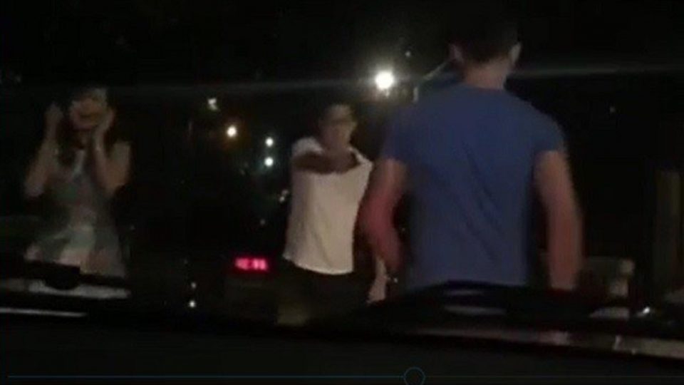 The unidentified shooter is still at large after shooting a nurse (right) four times. PHOTO: Screengrab from motorist’s video / Philippine Daily Inquirer