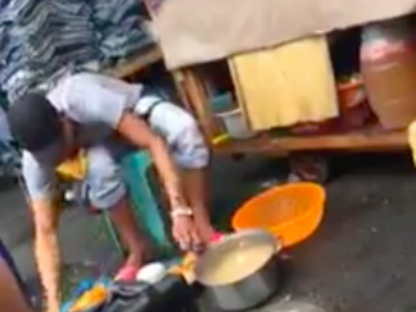 A kwek-kwek vendor washing quail eggs. PHOTO: screen grab from Facebook/ Matalinong Matsing