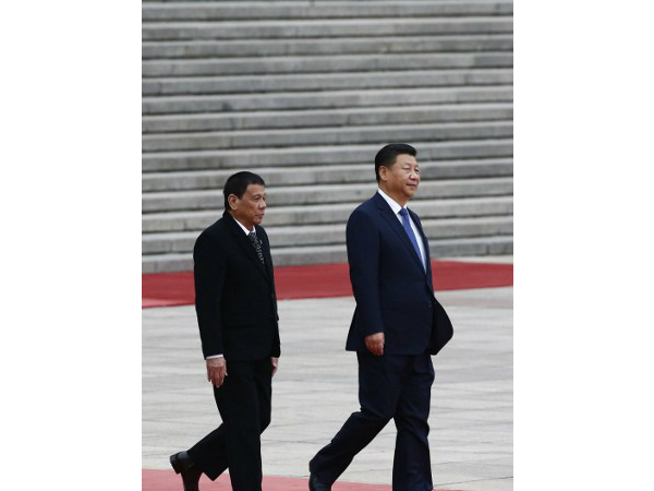 Philippine President Rodrigo Duterte (L) and Chinese President Xi Jinping. PHOTO: AFP, Thomas Peter