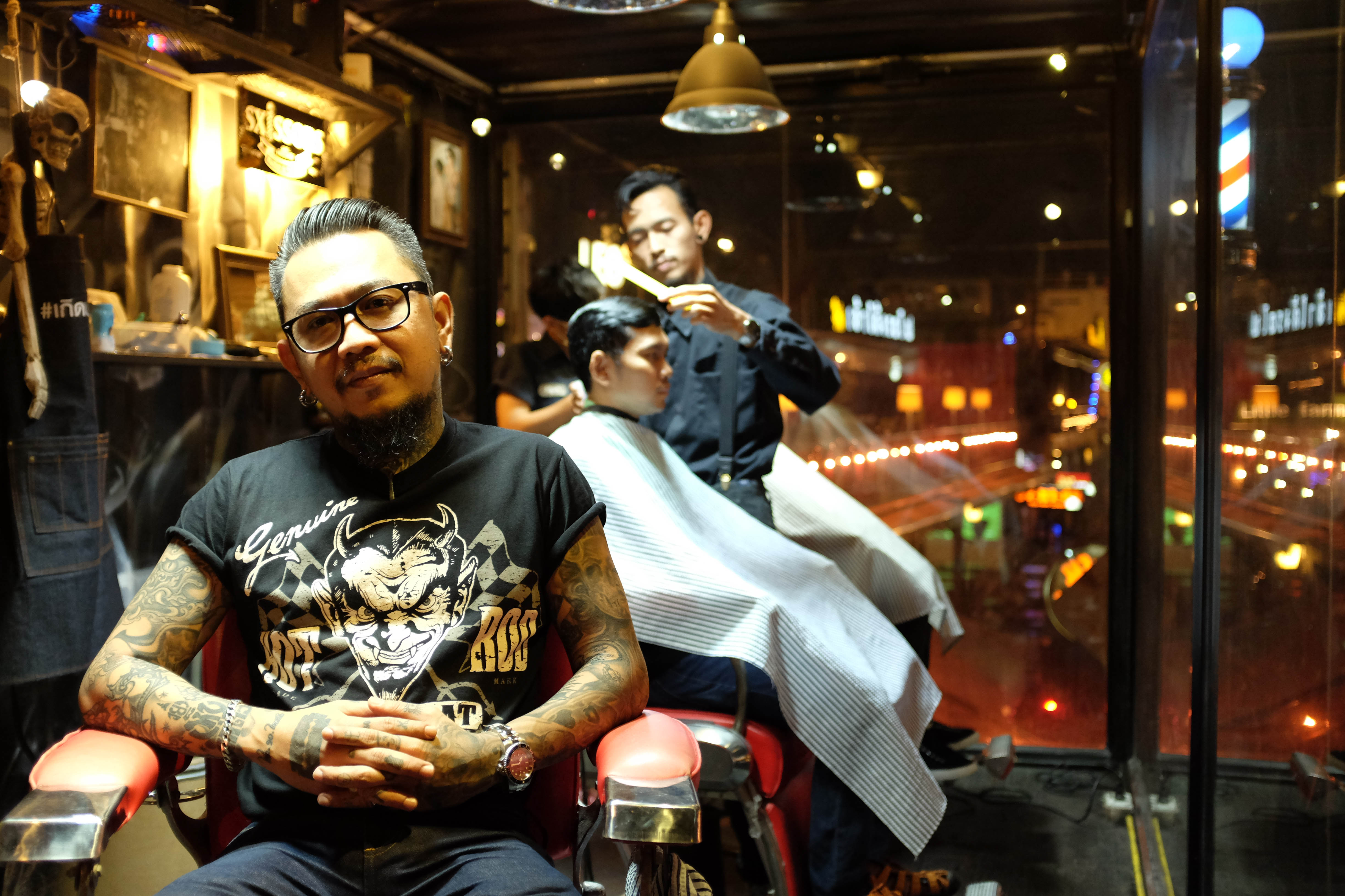Saksiri Jullakasean at Sxissors, the barbershop he owns at Ratchada Train Market. All photos: Matt Lucas.