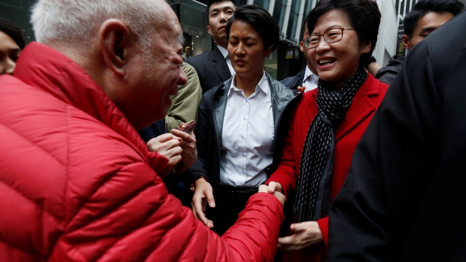 A man shakes hands with Carrie Lam, chief executive-elect, a day after she was elected in Hong Kong. Photo: Bobby Yip/Reuters