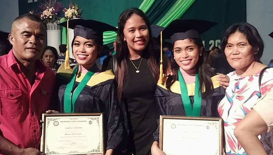 Twins Angelou and Angelyn Belocura pose with their sister and parents after graduating magna cum laude. Photo courtesy of the Belocura family
