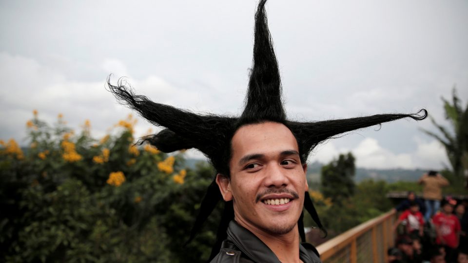 A punk community member enjoys a punk music festival in Bandung,  Indonesia West Java province, March 23, 2017. Picture taken March 23, 2017. REUTERS/Beawiharta