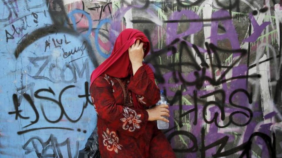 An Indonesian woman takes a break during shopping at Tanah Abang weekly Muslim market in Jakarta, May 7, 2015. REUTERS/Beawiharta
