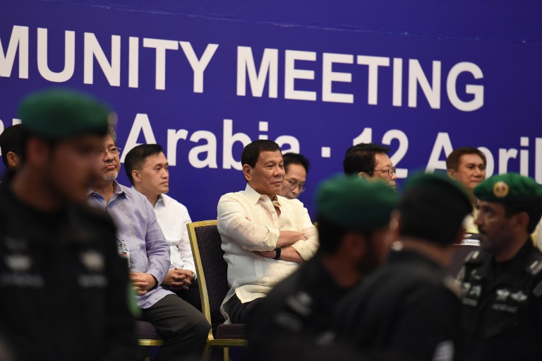 Philippine President Rodrigo Duterte attends a meeting with the Filipino community in the Saudi capital Riyadh, on April 12, 2017. 
Duterte is on a three-day visit to meet Saudi leaders for investment, trade and support for overseas Filipino workers in the Kingdom. / AFP PHOTO / FAYEZ NURELDINE