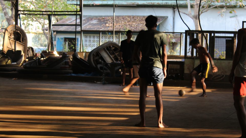 Youths play football in the abandoned amusement park Best Zone. Photo: Jacob Goldberg