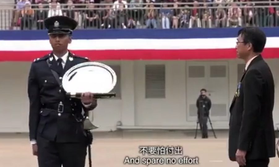 Abdul Faisal receiving the Brian Slevin Trophy for best all-round inspector at the police college passing-out parade on April 22, 2017. Screenshot: Hong Kong Police Force via Facebook.