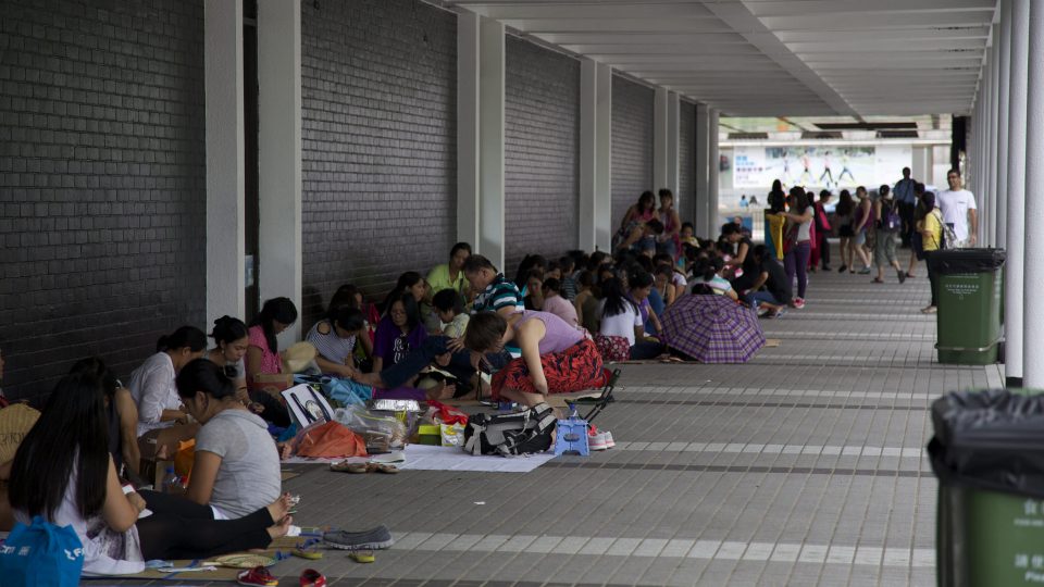 Domestic helpers sitting outside Hong Kong City Hall on a Sunday, the only day they get off work. Photo (for illustration): Myriam Tsen-Kung/Coconuts Media