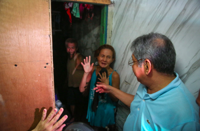 ommission on Human Rights Director Gilbert Boiser opens a secret door, masked by a cabinet, that leads to a hidden detention area at the Manila Police District Station 1. PHOTO: Fernando G. Sepe Jr., ABS-CBN News