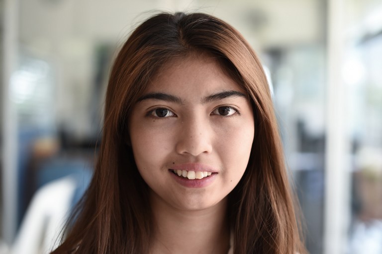This picture taken on April 21, 2017 shows Thai schoolgirl Naruedee Jotsanthia smiling for the camera at the Paveena Foundation in Bangkok. Photo: Lillian Suwanrumpha/ AFP