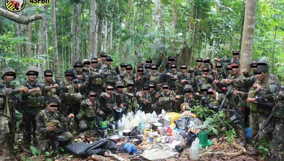 Members of Joint Task Force Basilan, consisting of the 4th Special Forces Battalion and 3rd Scout Ranger Regiment, pose for photos after seizing an Abu Sayyaf camp site at Barangay Pamatsaken, Sumisip, Basilan on Thursday. The troops also recovered explosive components capable of making improvised explosive devices (IEDs). Photo courtesy of 4th Special Forces Battalion