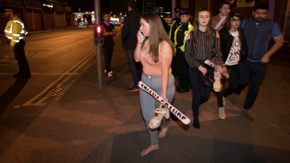 Concert goers react after fleeing the Manchester Arena in northern England where U.S. singer Ariana Grande had been performing in Manchester. Photo: Jon Super / Reuters